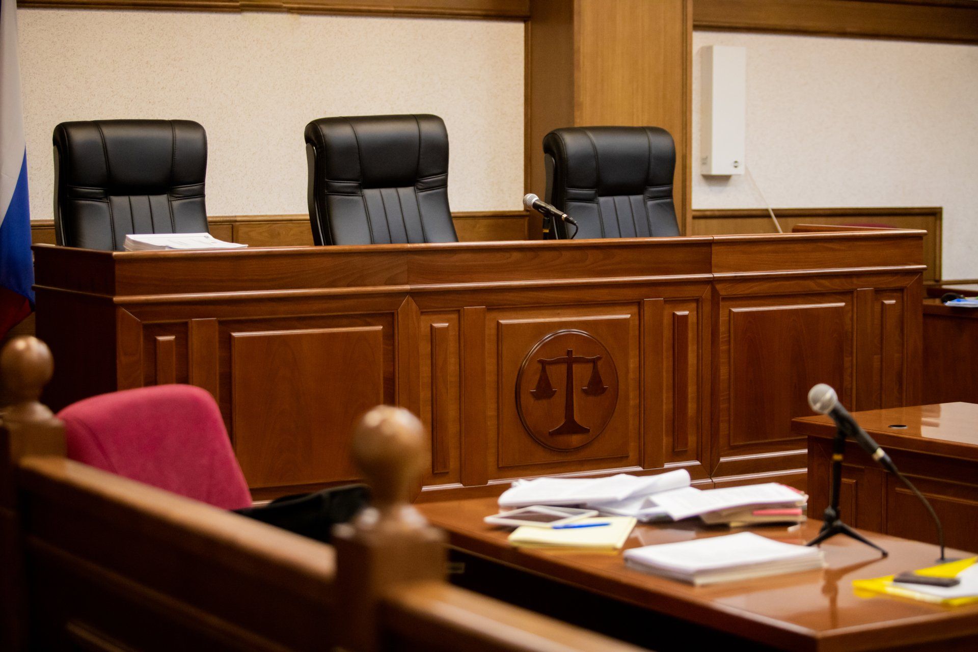 A judge 's bench with a scale of justice on it