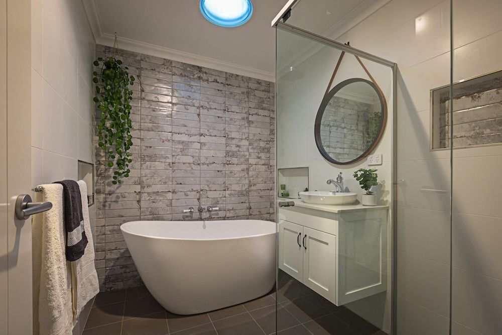 A Kitchen In A New Home With A Large Island In The Middle — Morphett Construction In Tamworth, NSW