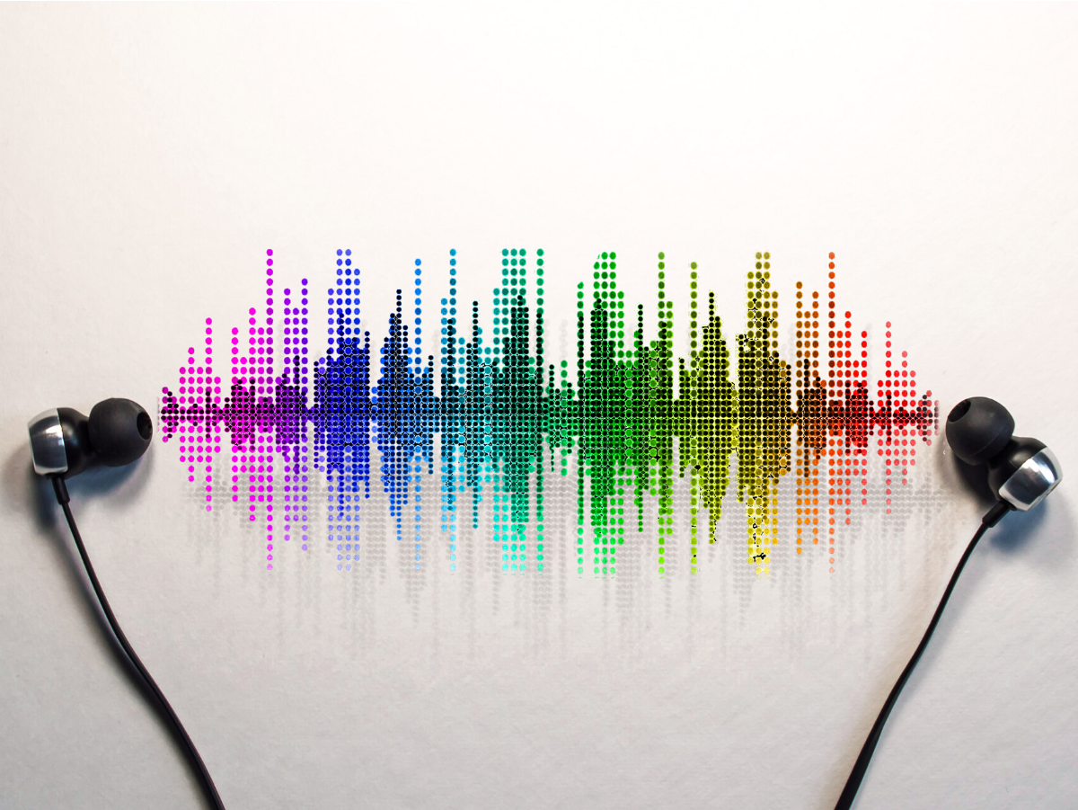 A pair of ear buds with a colorful sound wave behind them