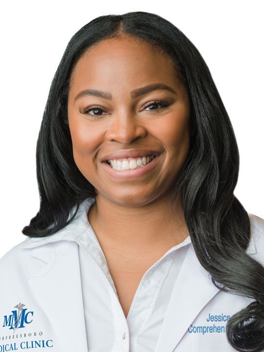 A woman wearing a white lab coat with the name jessica on it