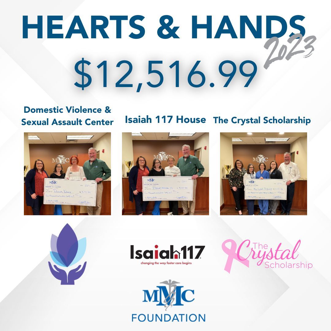 A group of people holding a check that says hearts and hands