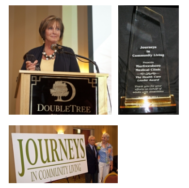 A woman stands at a podium in front of a sign that says journeys in community living