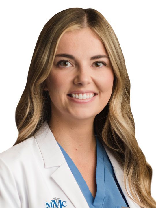 A woman wearing a white lab coat with the name jessica on it
