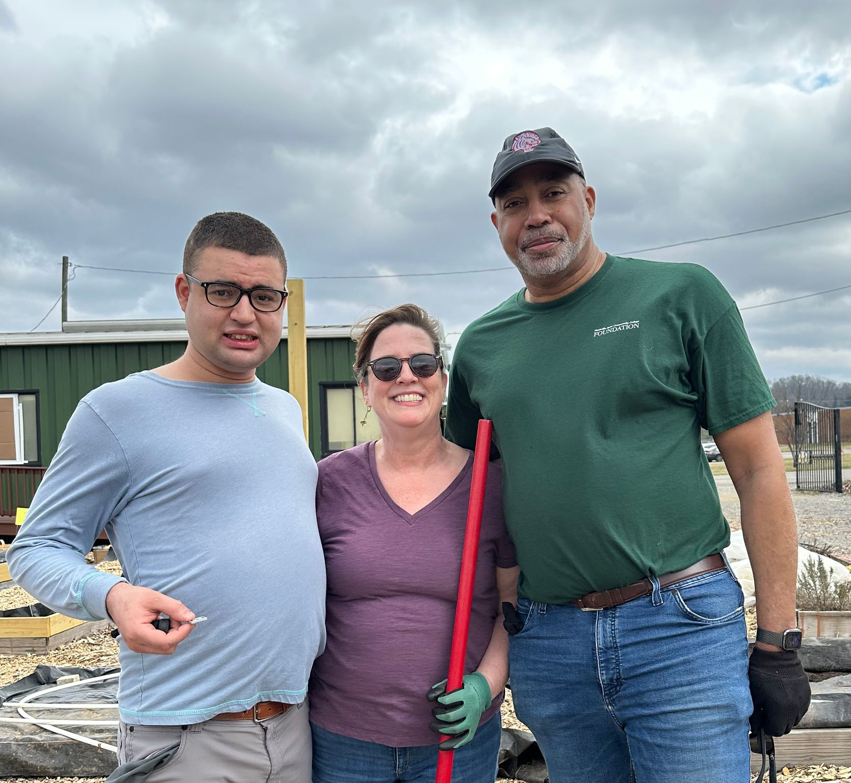 Rick with his wife and son outside at Belle Garden.
