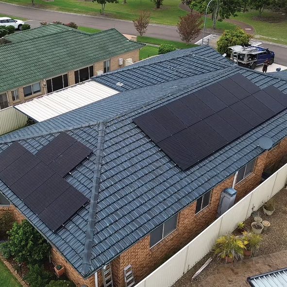 An House With Solar Panels on the Roof — DLG Electrical and Solar In Wyong, NSW