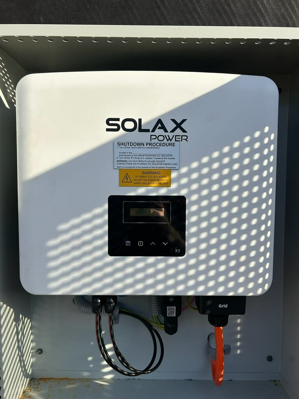 A Solar Power Inverter is Sitting Inside of a Box — DLG Electrical and Solar In Wyong, NSW