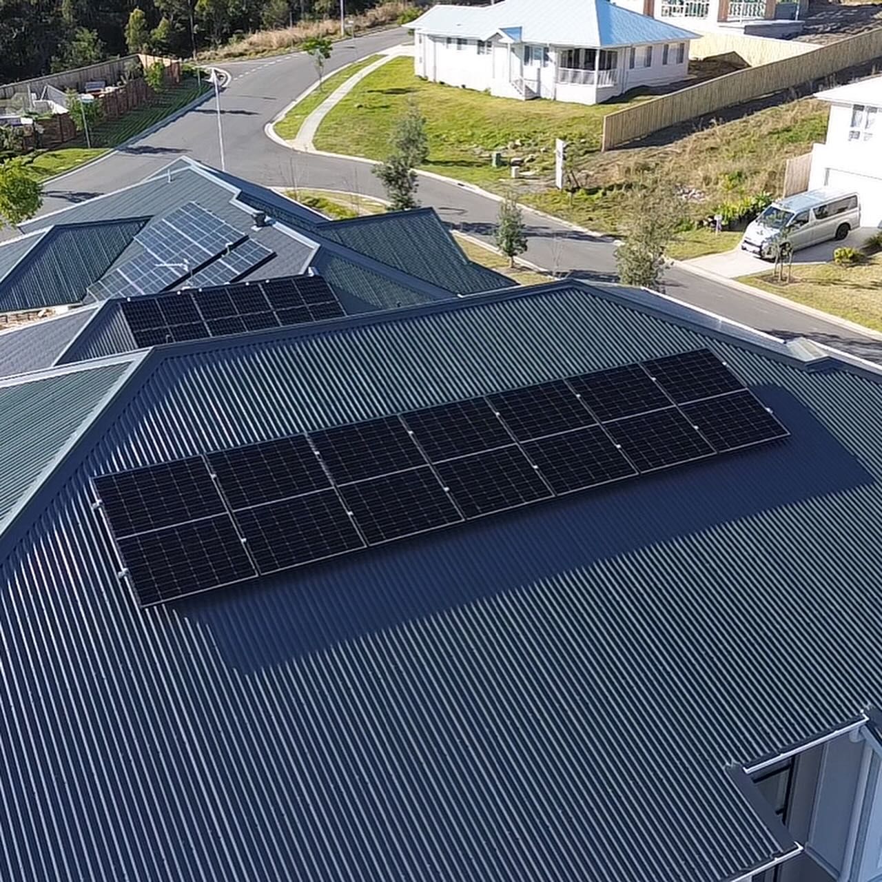An Aerial View of a House With Solar Panels on the Roof — DLG Electrical and Solar In Wyong, NSW