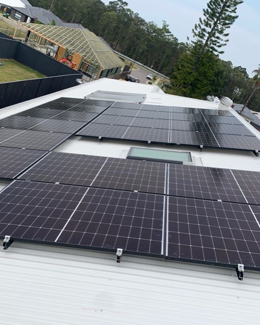There Are Many Solar Panels on the Roof of a House — DLG Electrical and Solar In Wyong, NSW