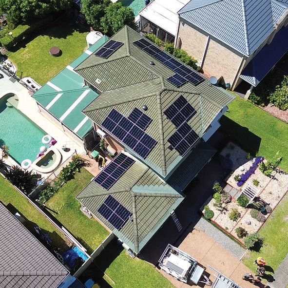 A Drove View of a House With Solar Panels on the Roof — DLG Electrical and Solar In Wyong, NSW