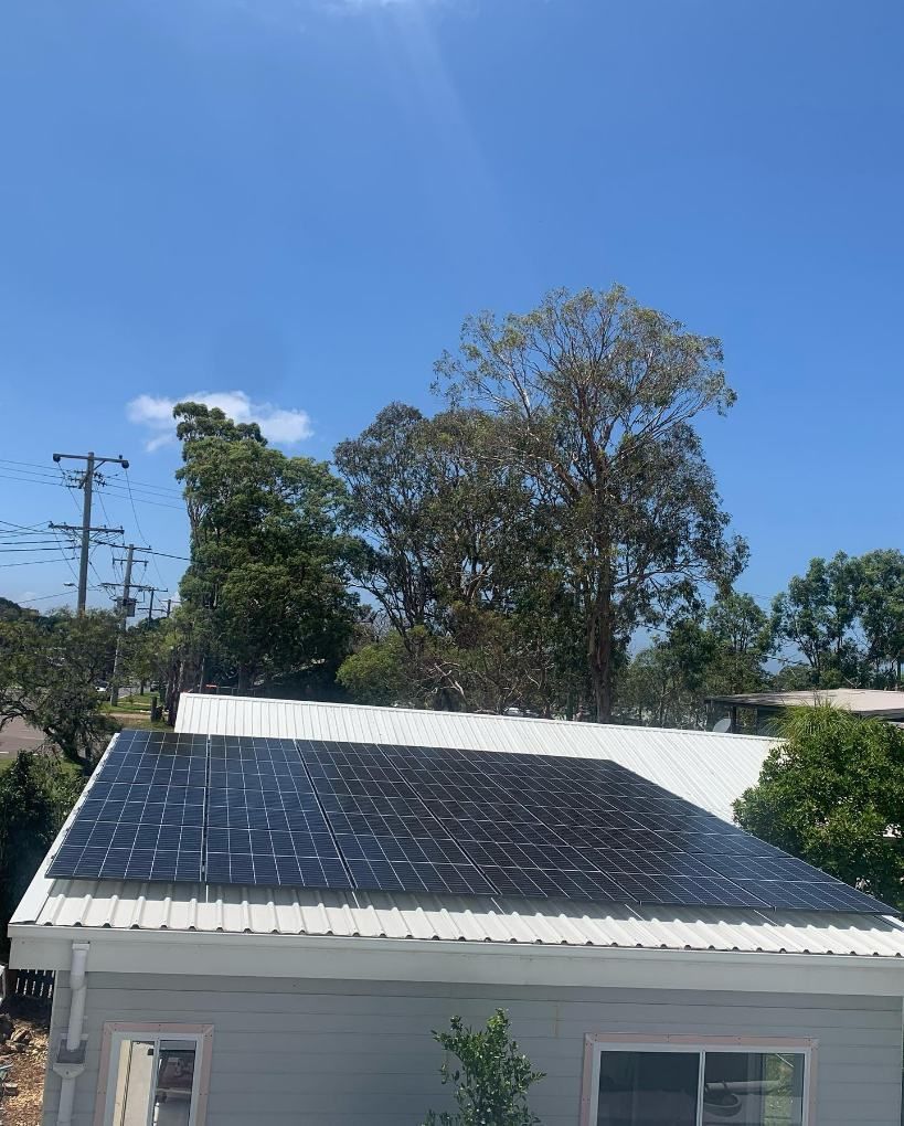 A House With a Lot of Solar Panels on the Roof — DLG Electrical and Solar In Newcastle, NSW