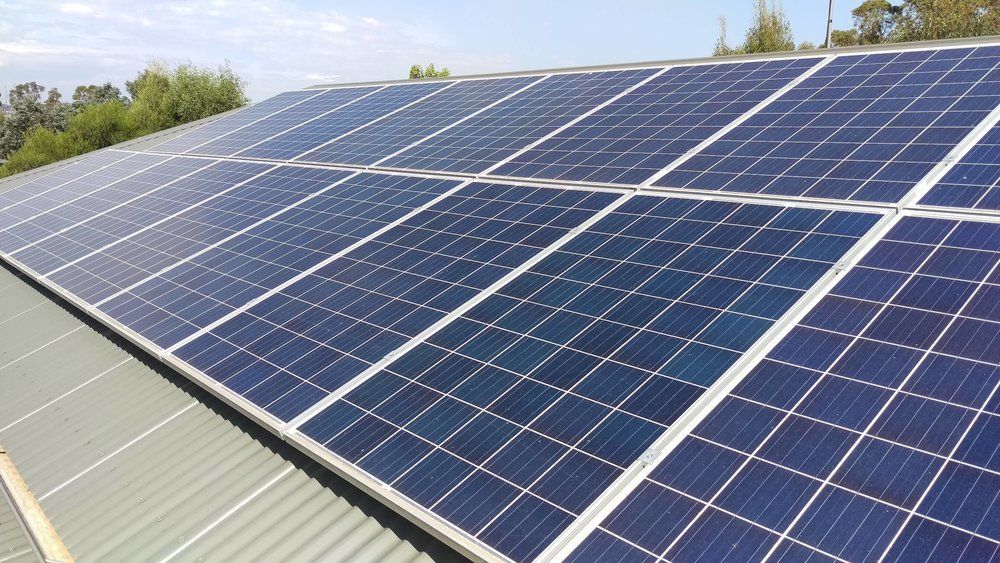 A Roof With a Lot of Solar Panels on It — DLG Electrical and Solar In Hunter Valley, NSW