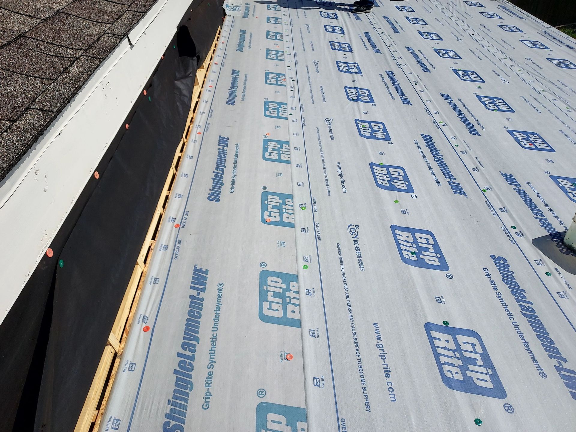 A roof with a lot of roofing material on it