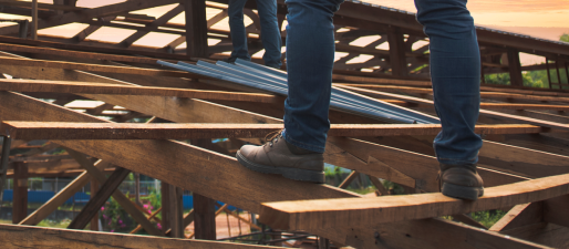 A person is standing on a wooden structure.