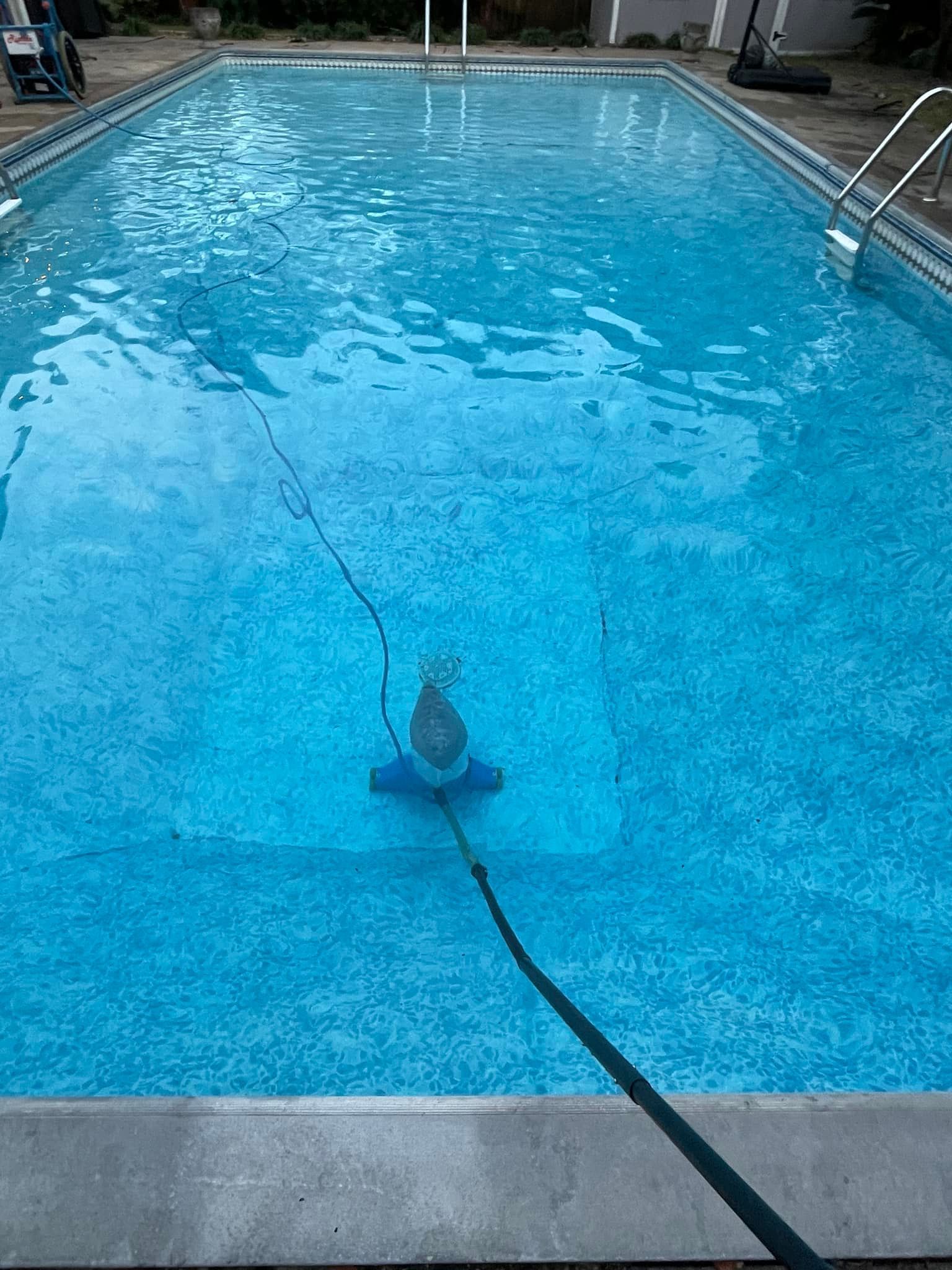 Pool Cleaner Vacuuming a Pool