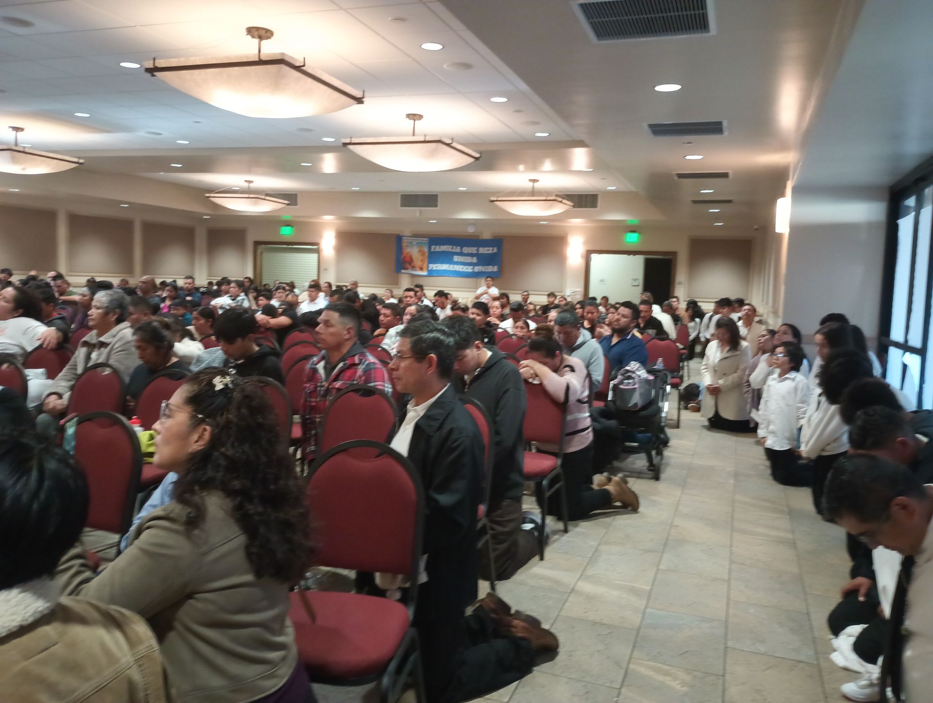 Large conference room filled with seated attendees during a presentation or meeting.