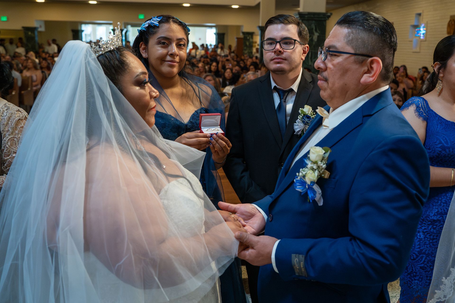 Bride and groom exchanging rings during a wedding ceremony indoors