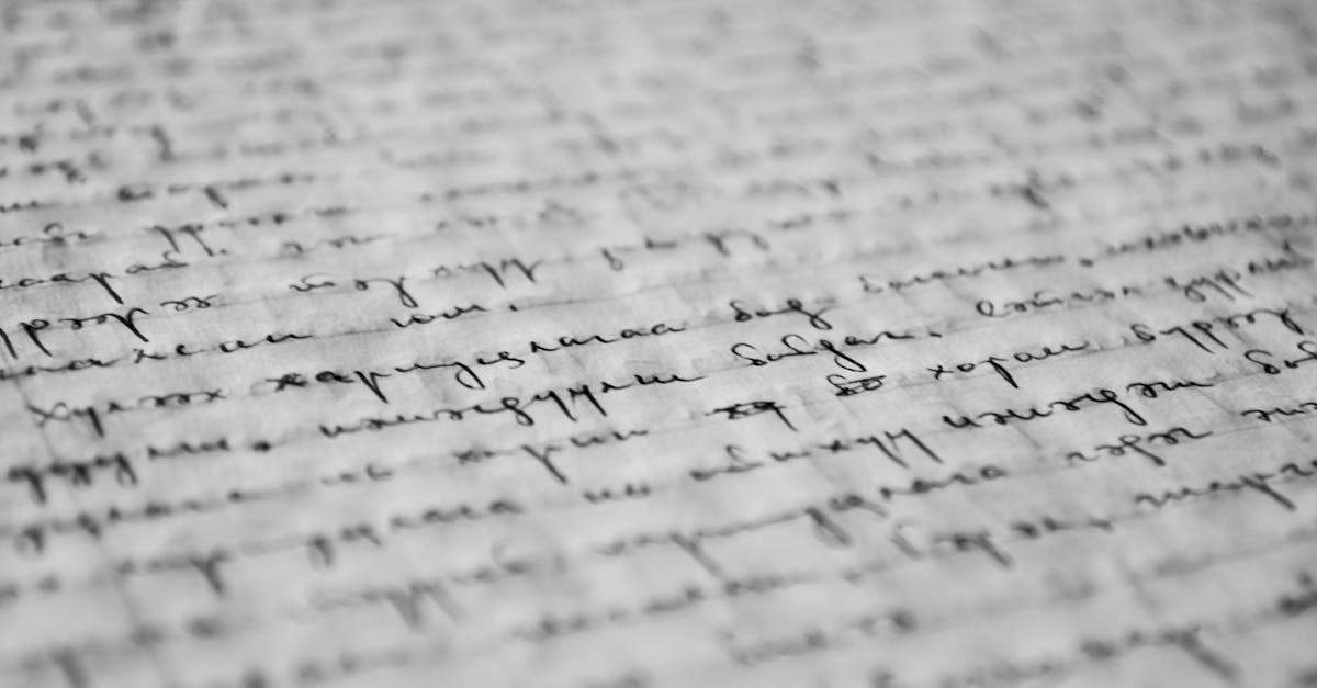 Close-up of handwritten cursive text on a lined page, slightly out of focus.