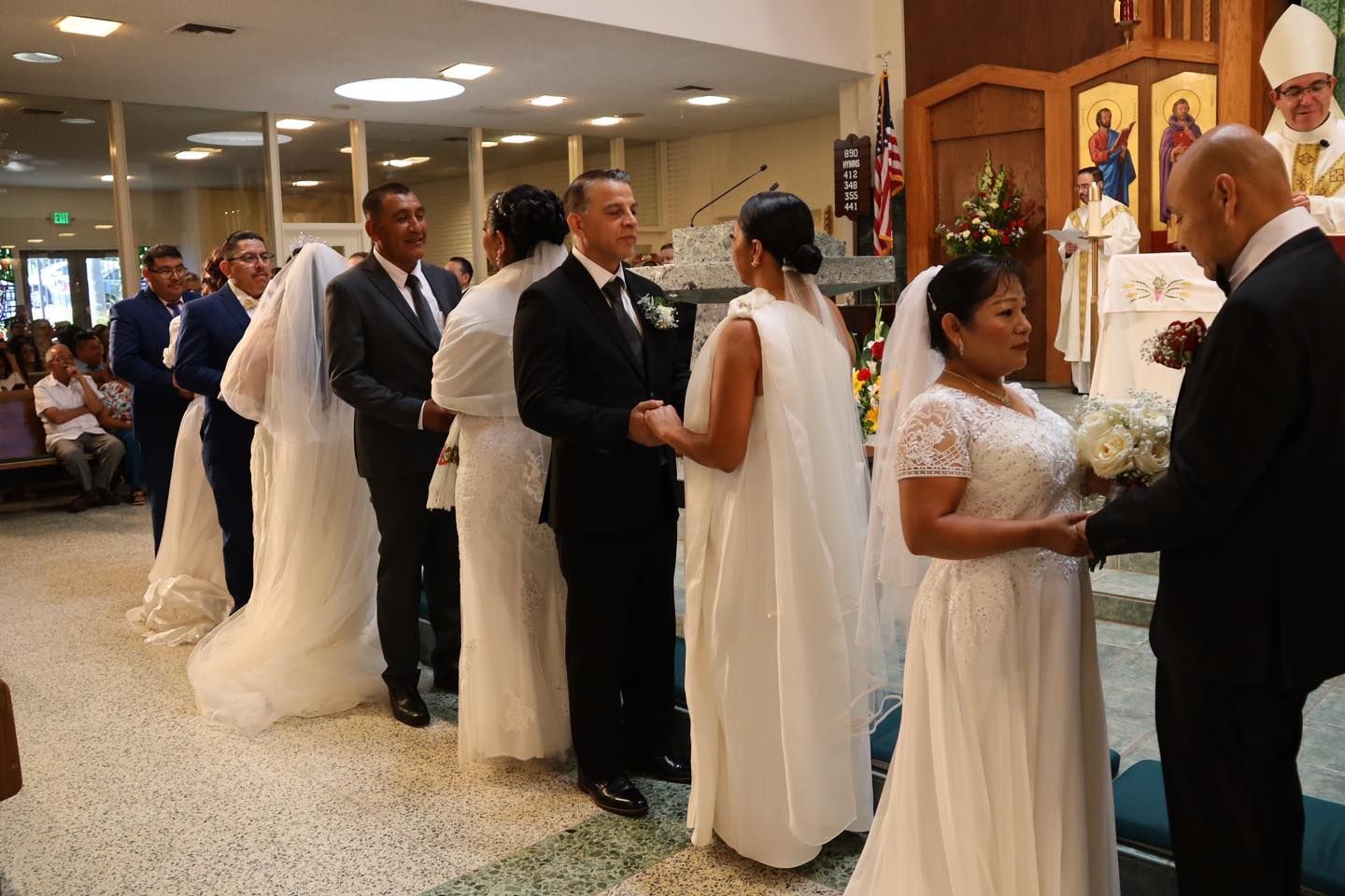 Wedding ceremony with bride and groom exchanging vows at a church altar