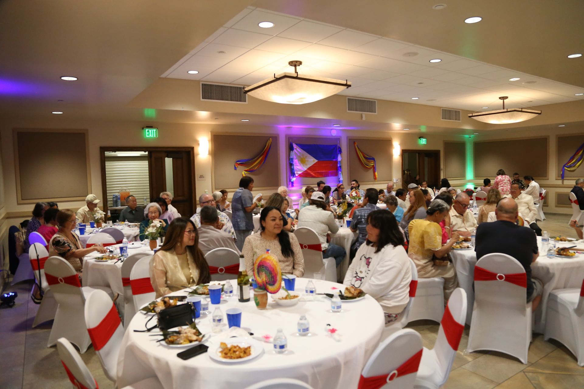 Banquet hall with guests seated at round tables during a formal dinner event