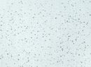 White surface speckled with various sized gray granules.