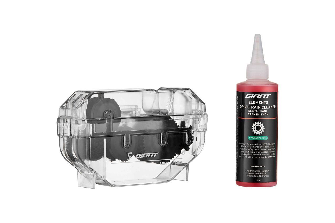 Chain cleaning tool and bottle of red lubricant.