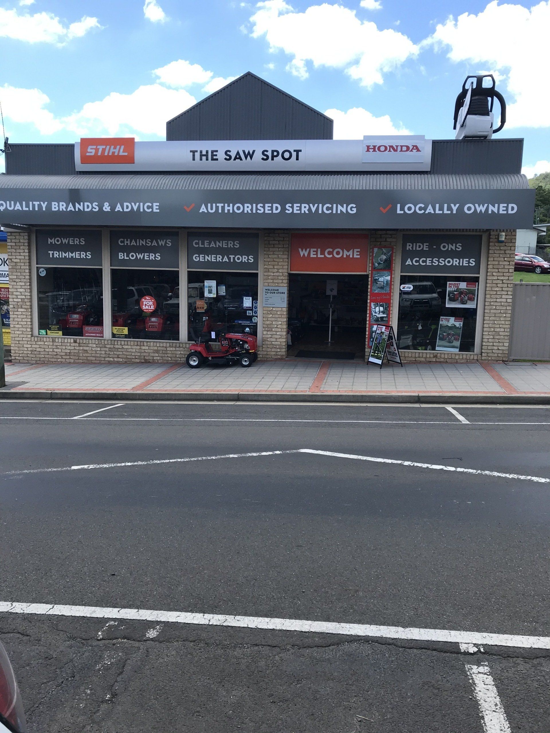 Lawn Mower On Green Grass — The Saw Spot In Kyogle NSW