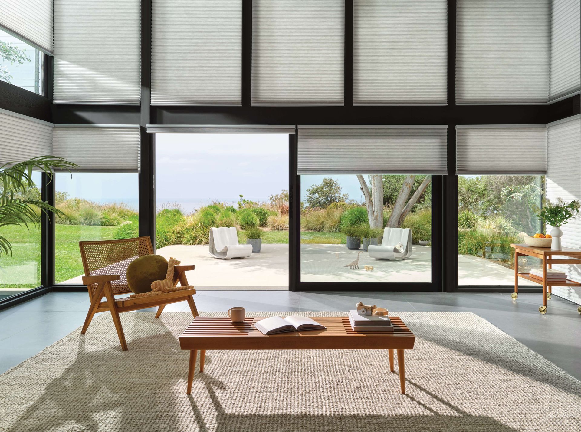Stylish sunroom window treatments with soft shades blending natural light and comfort.