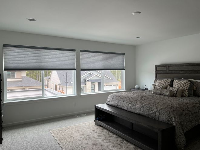 Custom cellular shades installed in a modern bedroom by Pugerudes