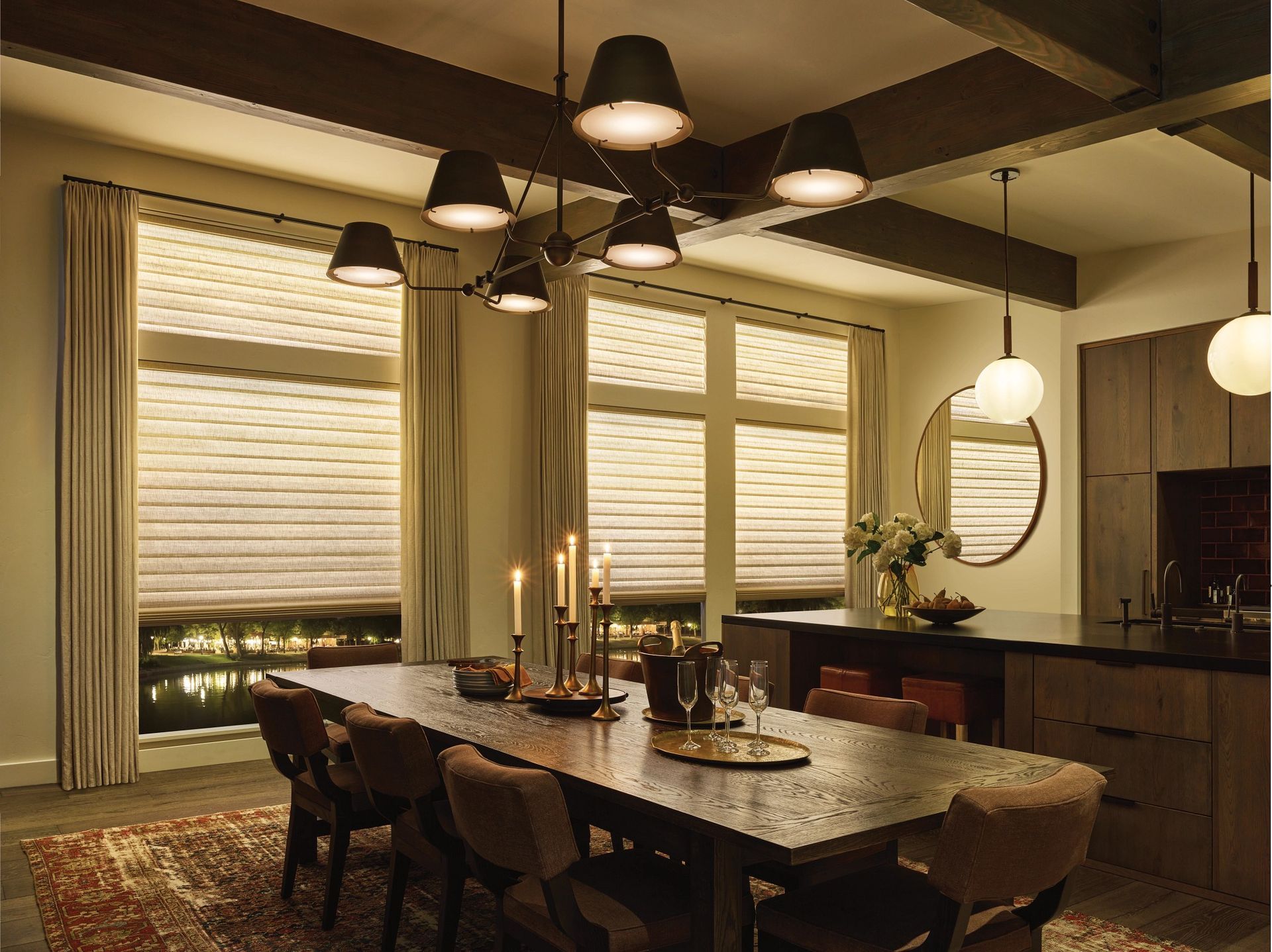Custom window treatments with layered Roman shades in a warm Bellevue dining room for winter comfort.