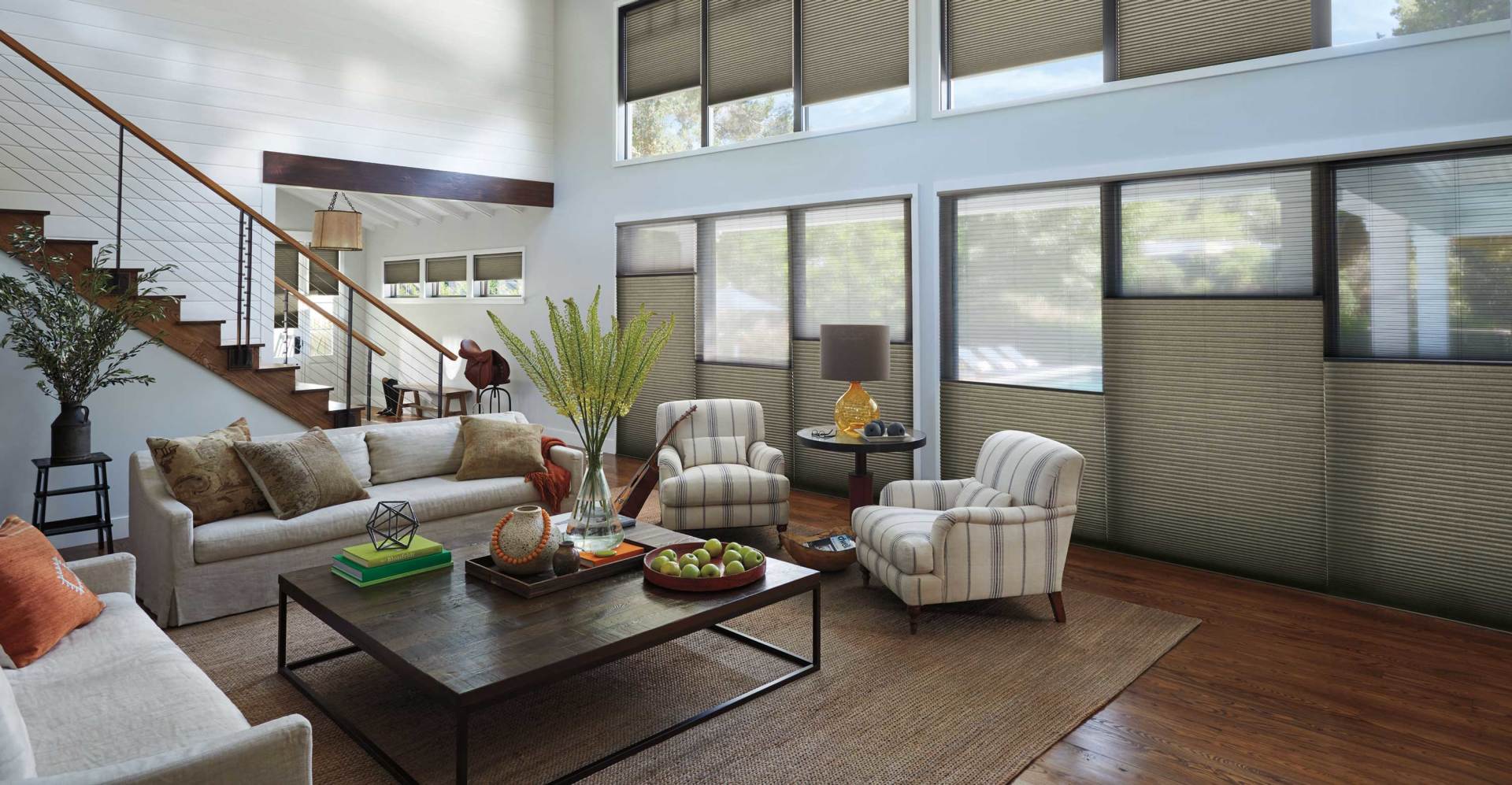 Duette Honeycomb Shades by Hunter Douglas in a cozy Kent living room with natural light and warm earthy tones.
