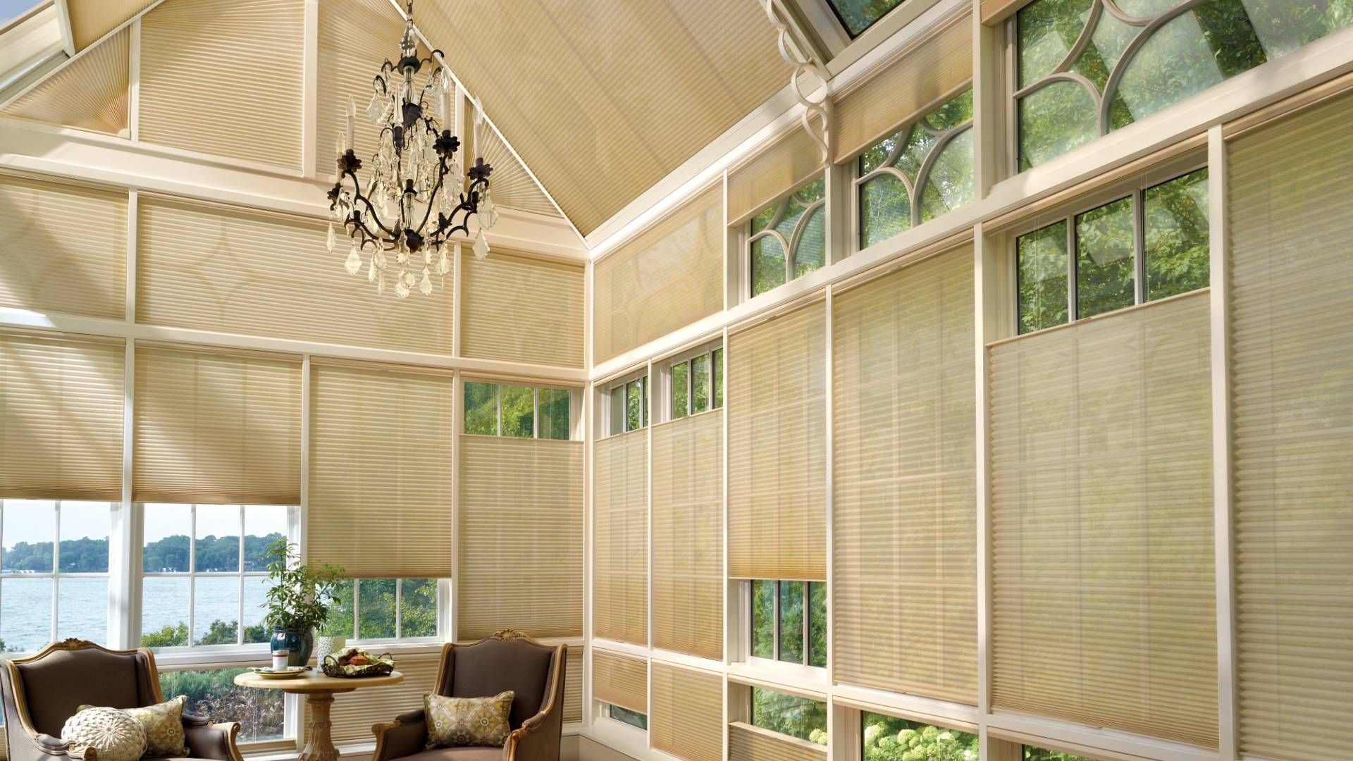 Sun room with custom top-to-bottom honeycomb shades.