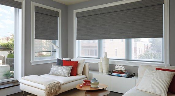 Bright living room with sleek solar shades providing UV protection and comfort for spring and summer.