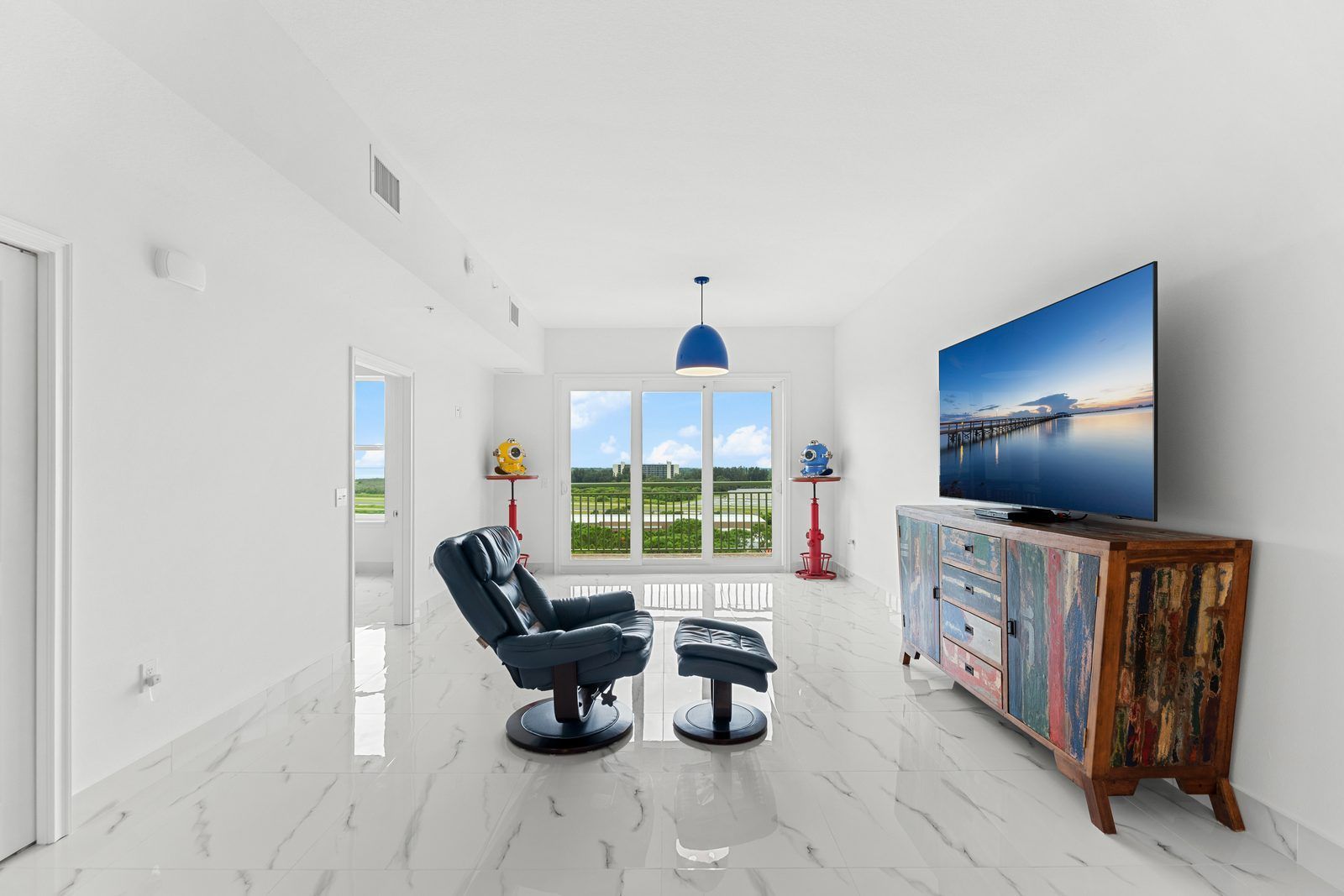 Living room at Residence 1012 with balcony doors and river view