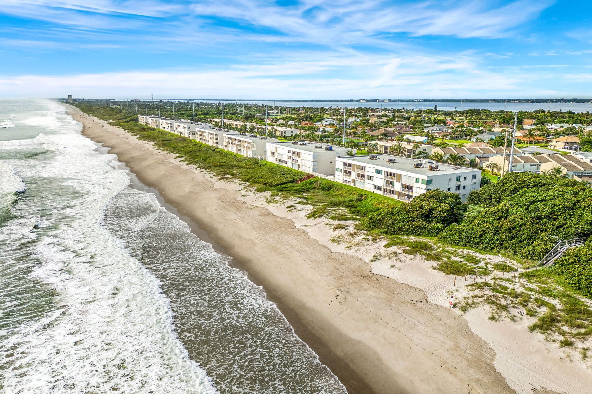 Oceanfront condominium and Atlantic shoreline in Melbourne Beach, illustrating the coastal setting in Dustin’s property photography.