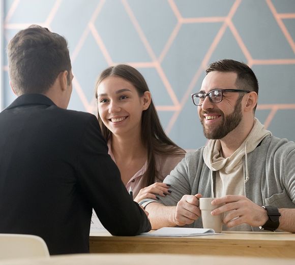 Man talking to clients Man talking to clients
