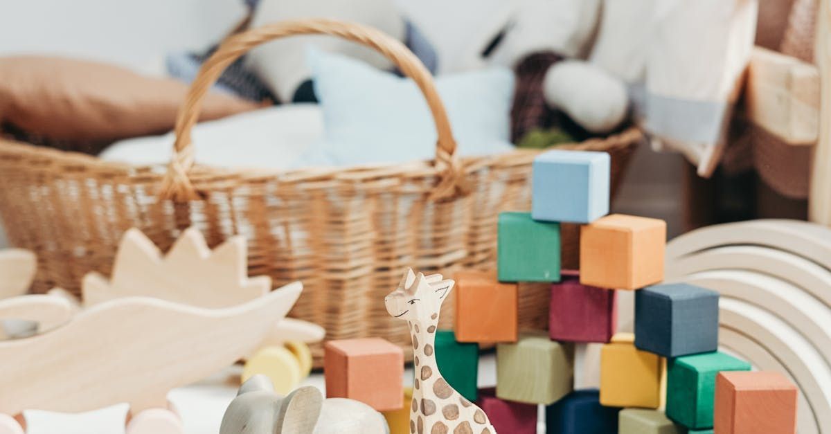 Colorful wooden toy blocks and a basket on a soft play surface