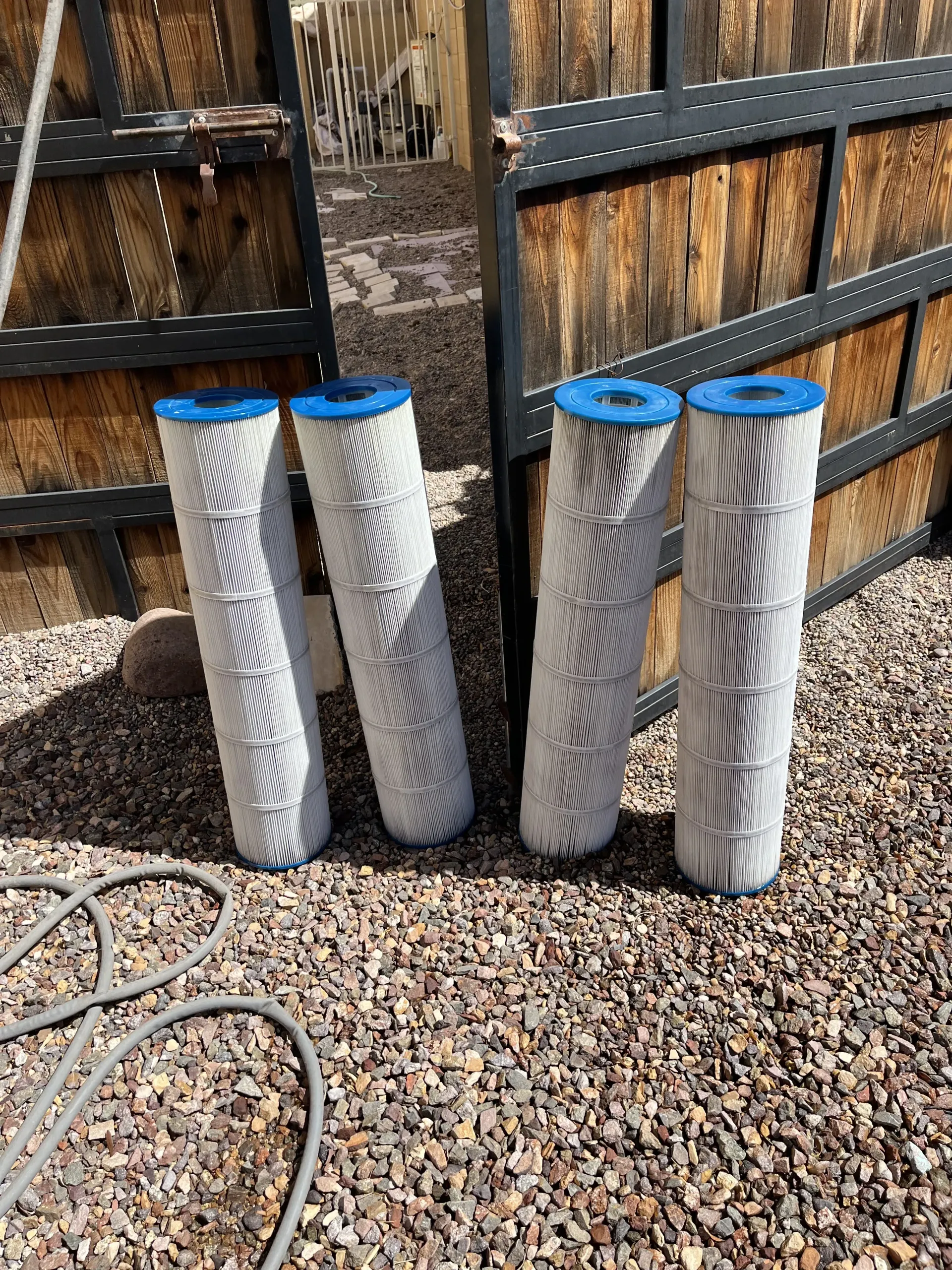 Four clean pool filter cartridges after service by AZ Veteran Pools in the Greater Phoenix Area