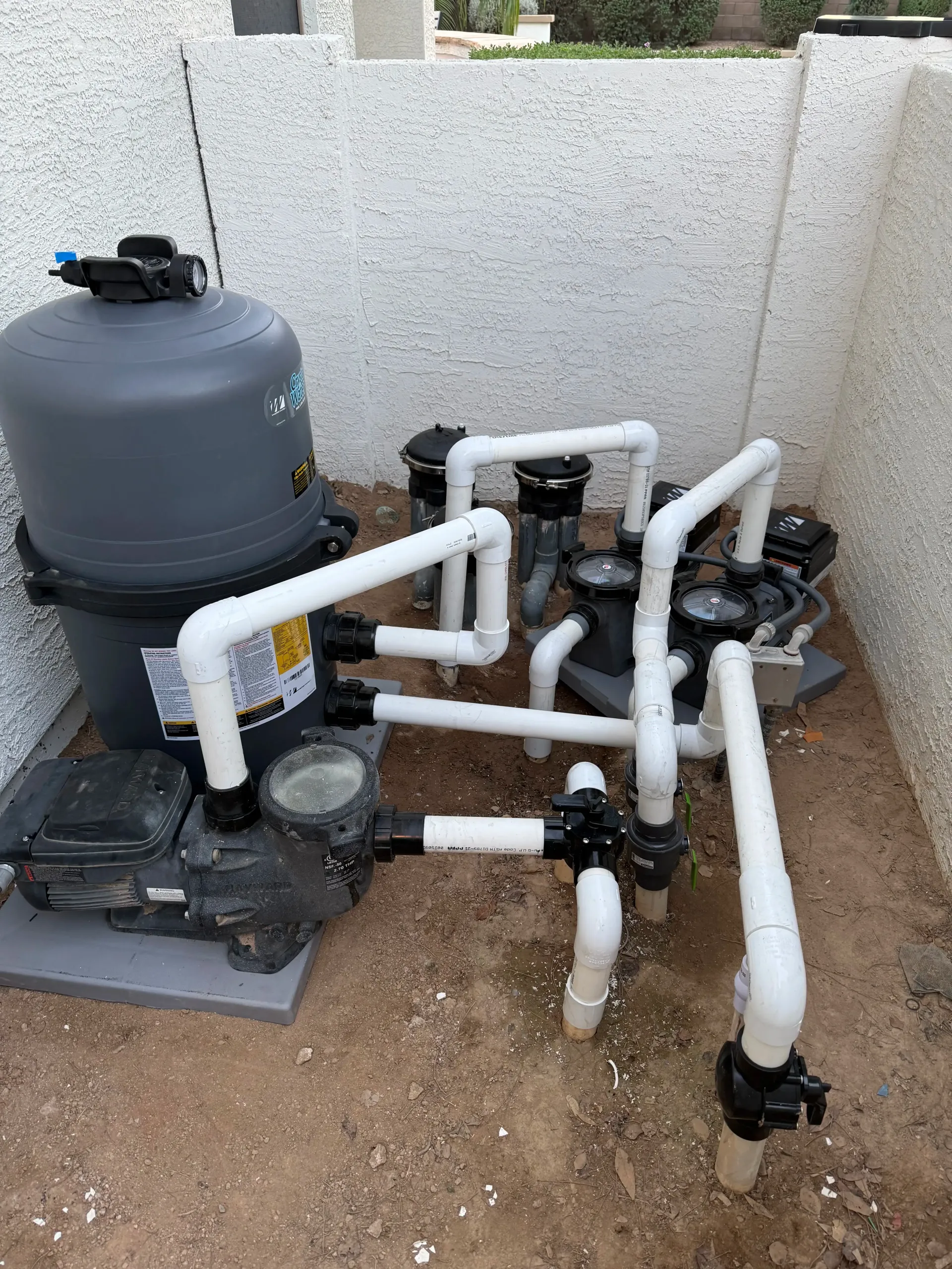 Repaired pool equipment pad with new cartridge filter and PVC plumbing installed by AZ Veteran Pools in Phoenix, AZ