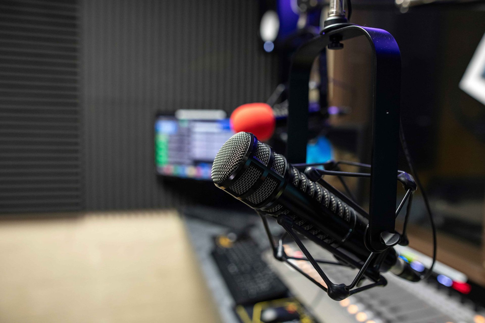 A close up of a microphone in a radio studio.