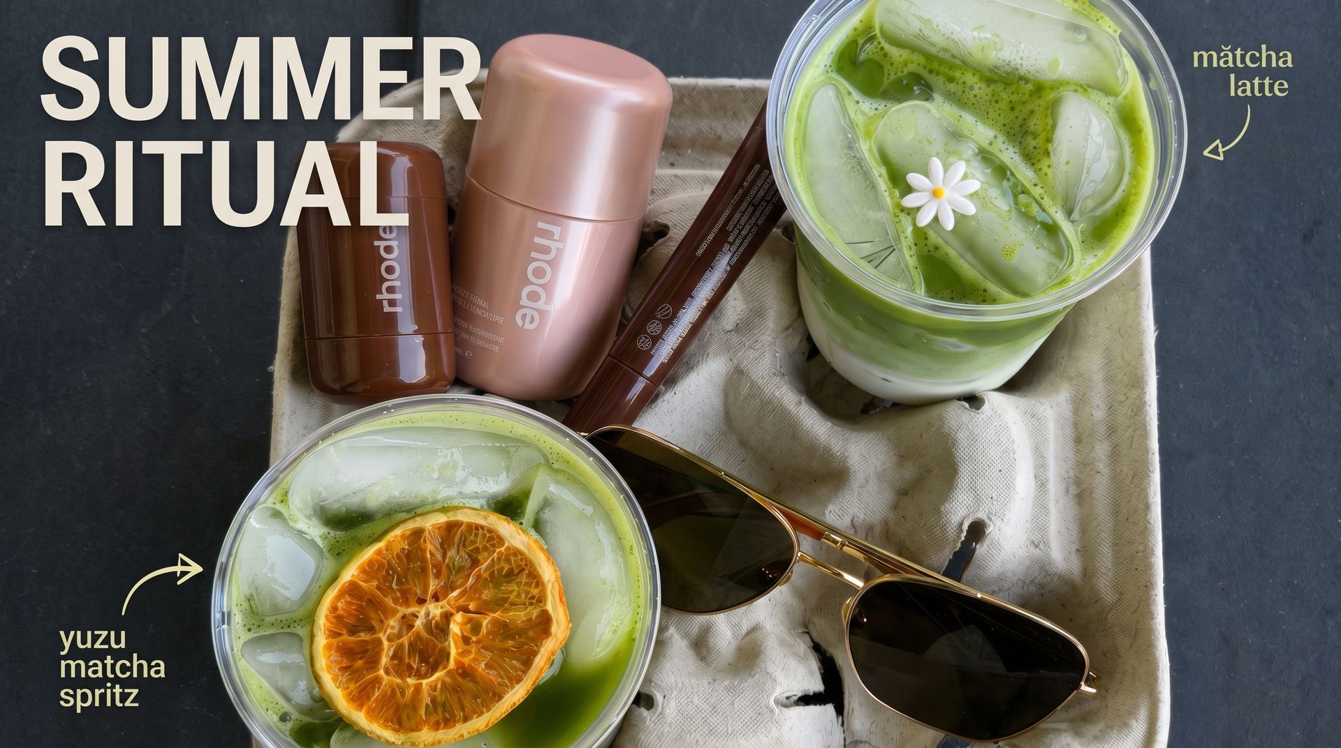 Summer ritual flat lay: iced green drink, orange garnish, rose gold tumbler, sunglasses, and a wrapped snack.