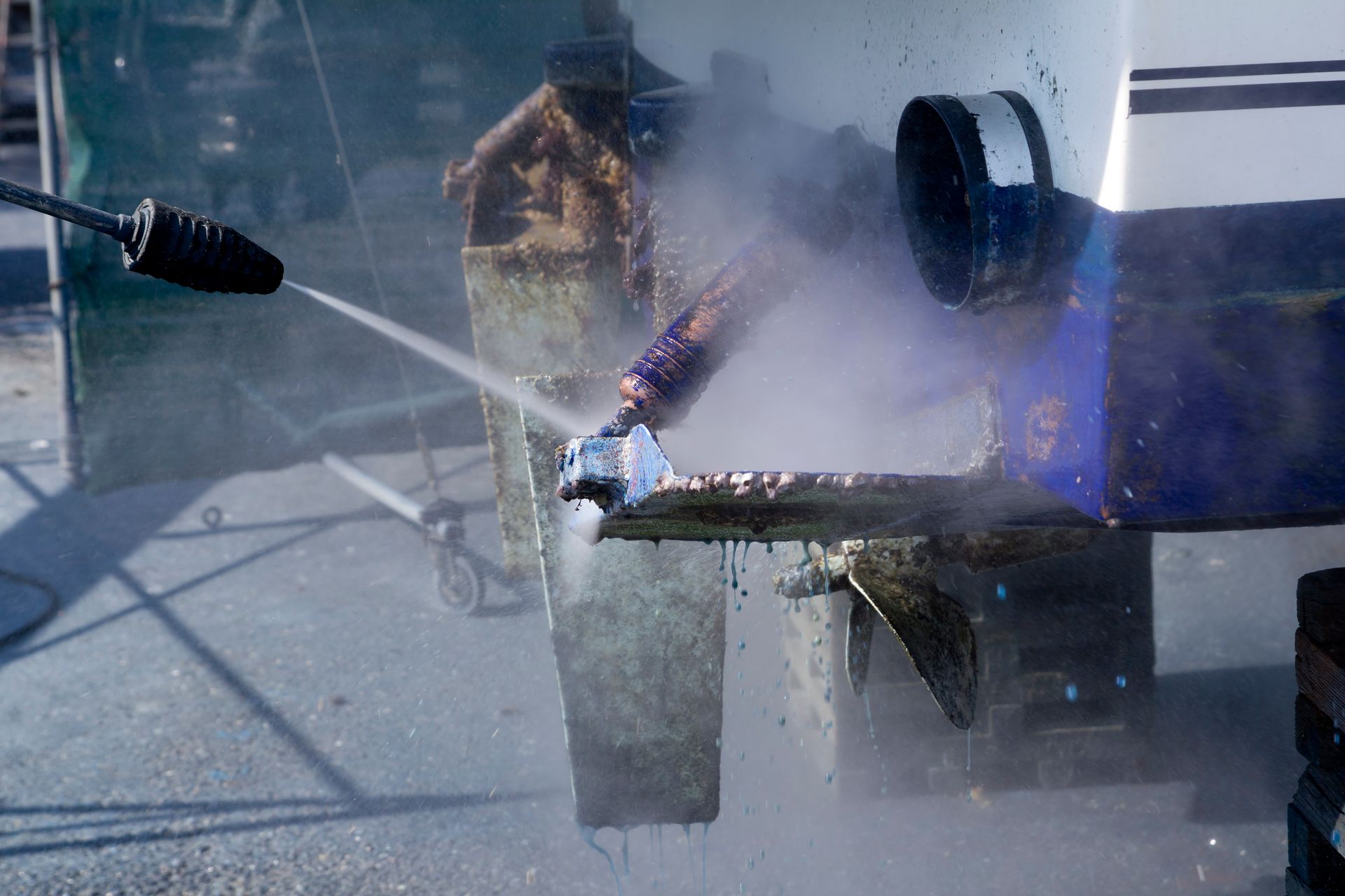 Bridge of a ship with navigation displays and control panel, overlooking the ocean.