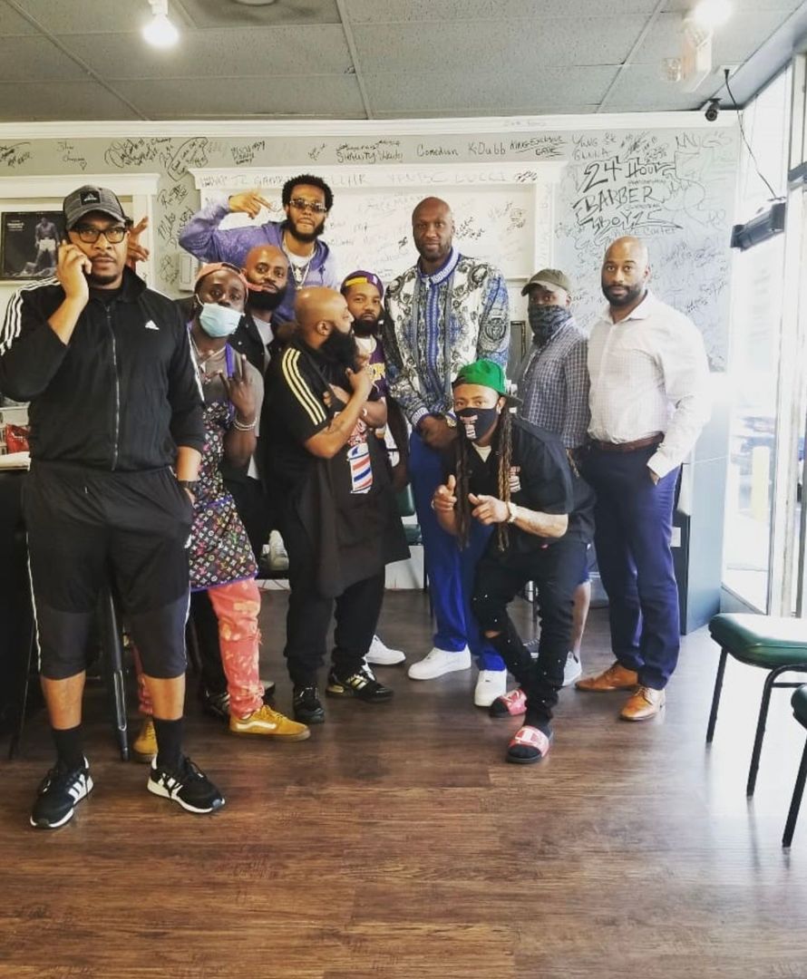 A group of men are posing for a picture in a room