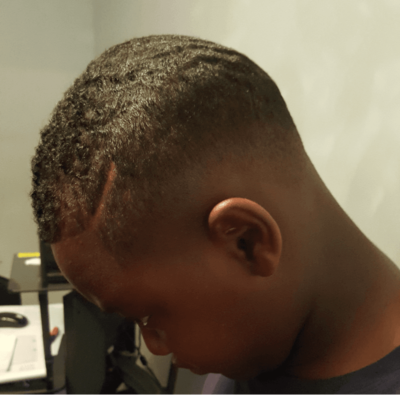 A close up of a man 's head with his eyes closed