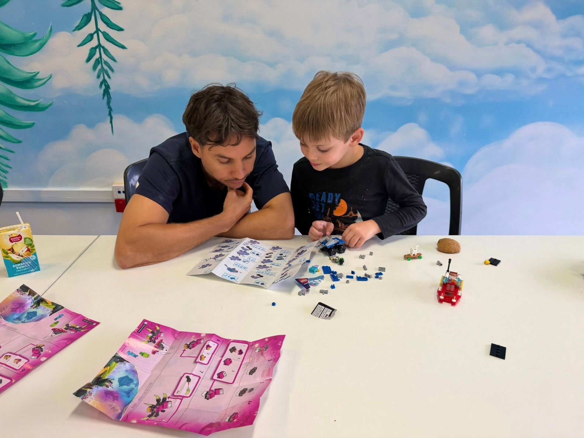 Two People Assembling a Small Puzzle at a White Table — Sparks Social Abilities in Bungalow, QLD