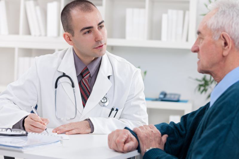 Medical staff asking questions to the patient Medical staff asking questions to the patient