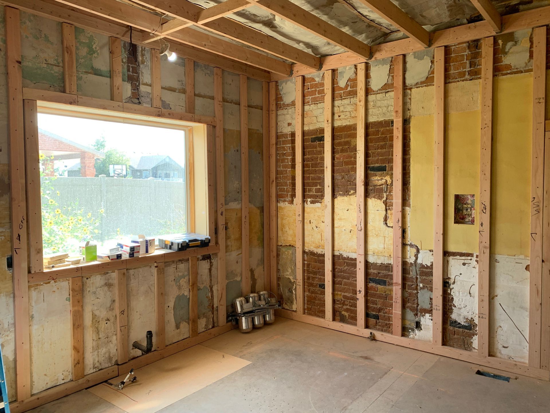 A room with wooden walls and a window in it.