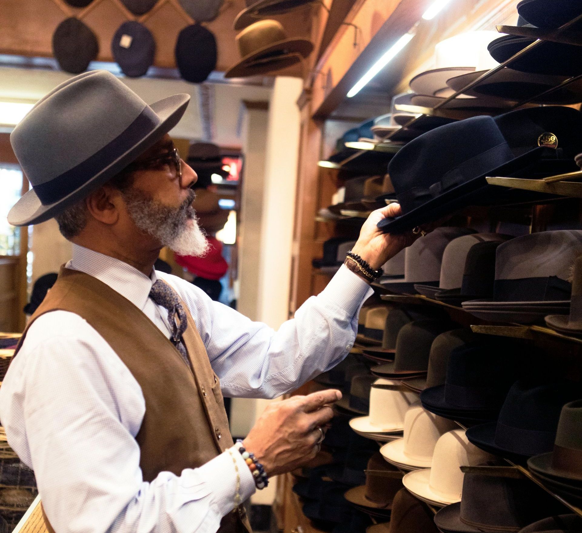 Man shopping for hats