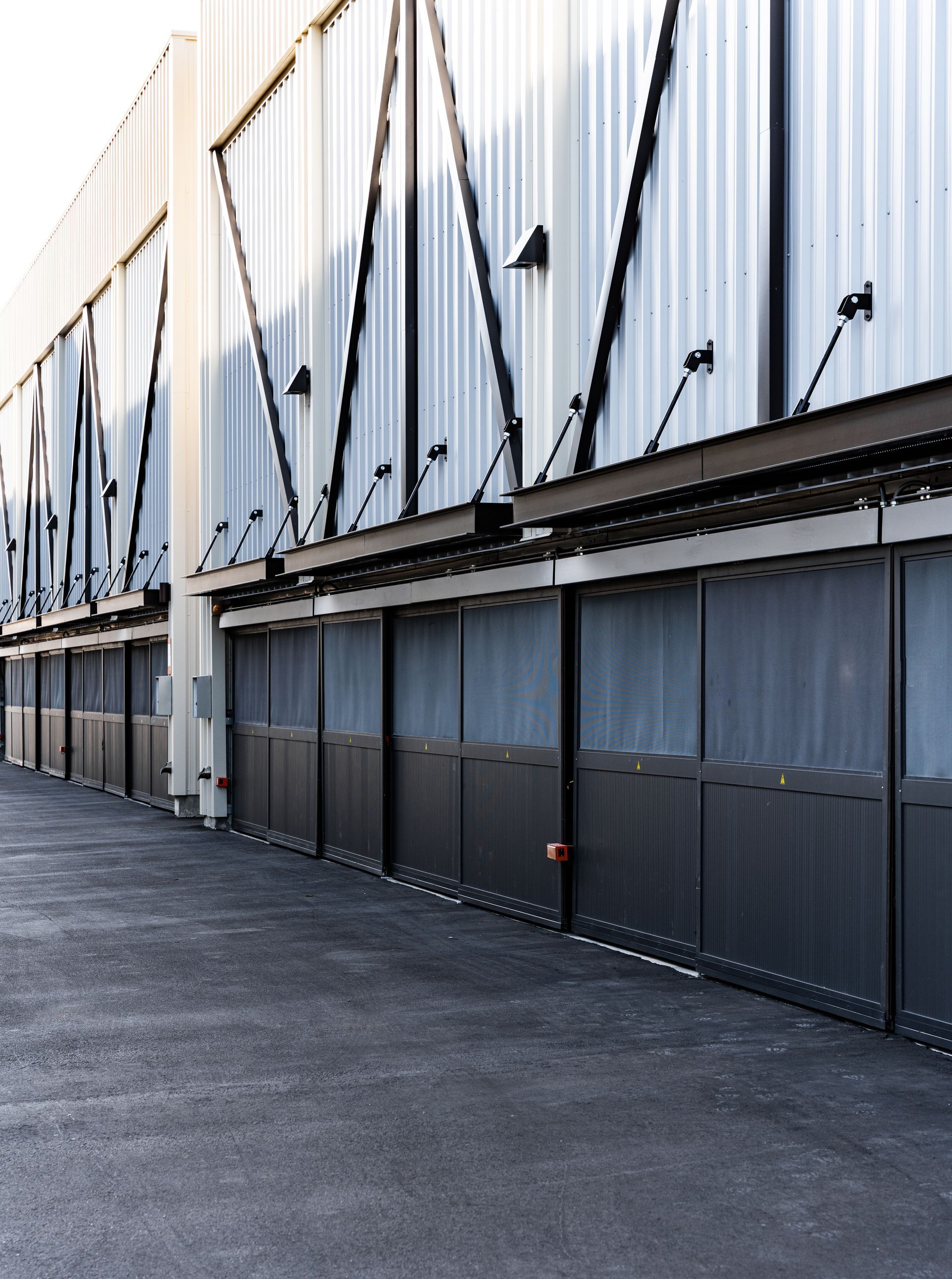 A row of garage doors on the side of a building