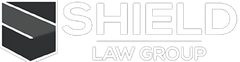 The logo for the shield law group is a black and white logo with a shield on it.