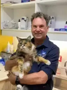 Dr Sam Haynes, Practice Owner and Veterinarian, holding a cat named Bonnie